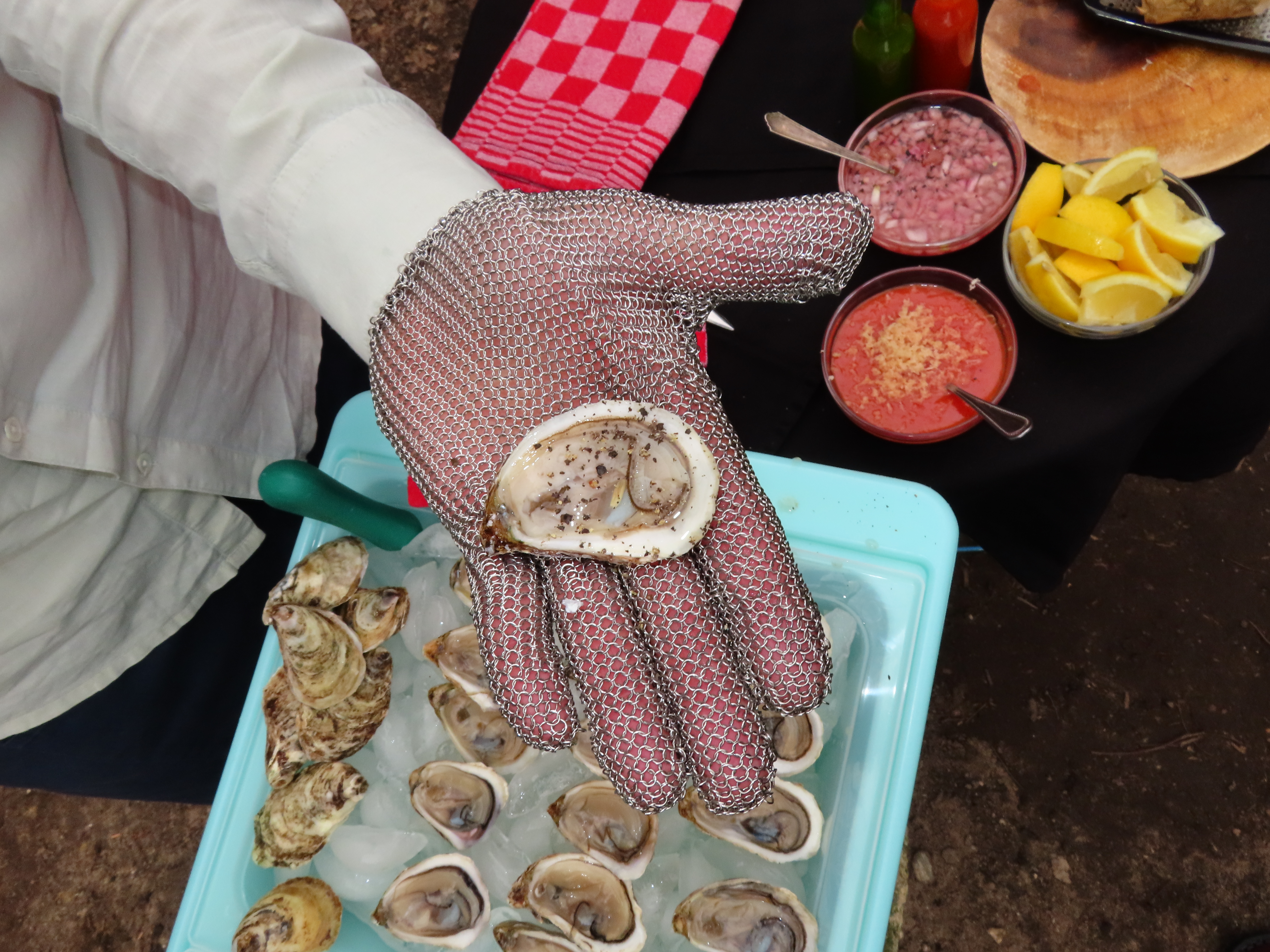 Dressed oyster with condiments.