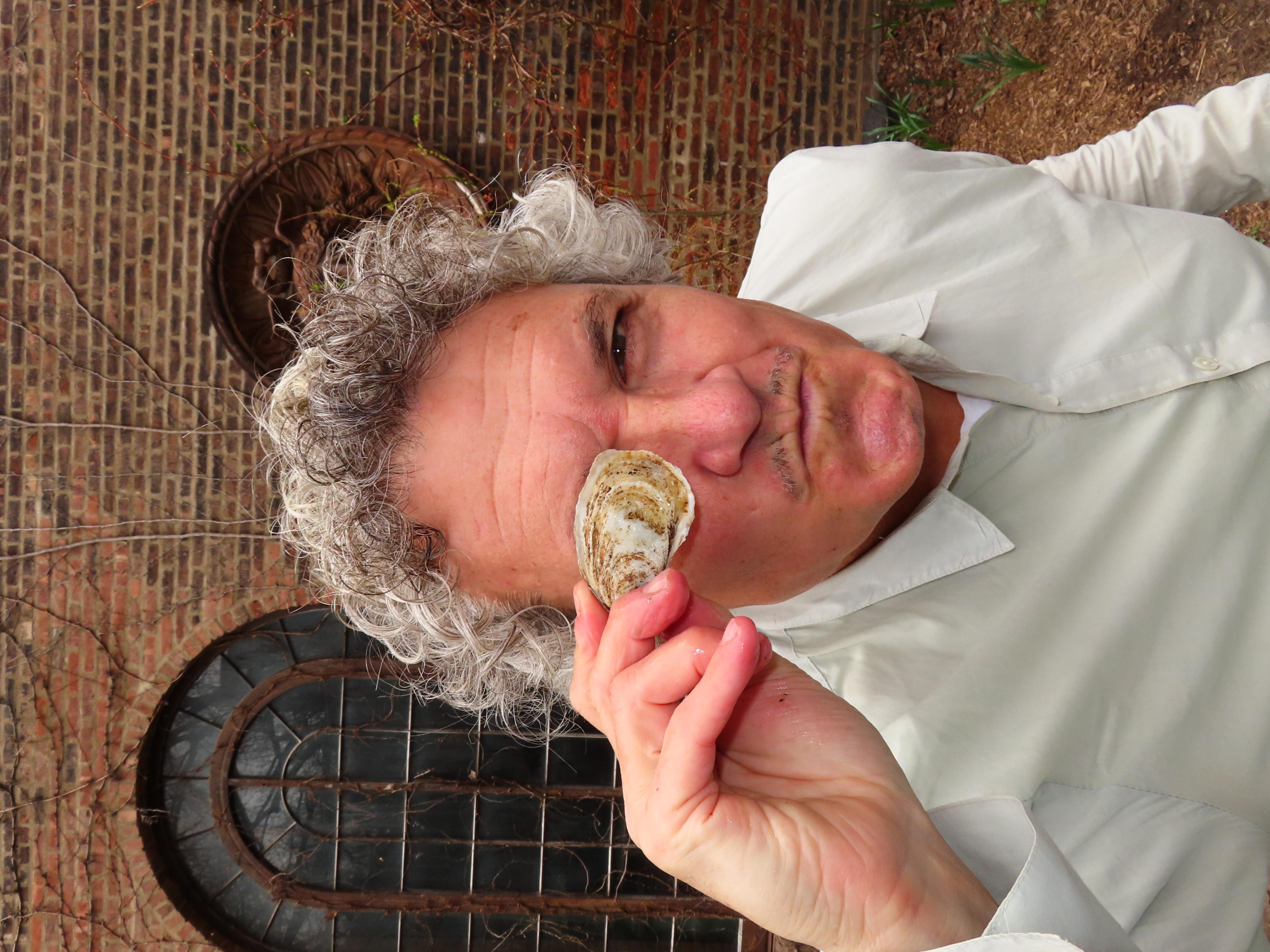 Rifko holding an oyster over his eye.